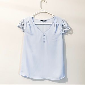 Blouse with crocheted cap sleeves